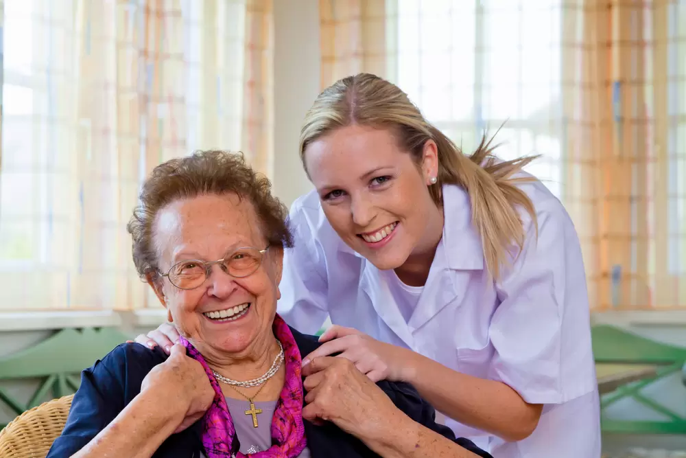 Care home nurse and patient {{brizy_dc_image_alt entityId=